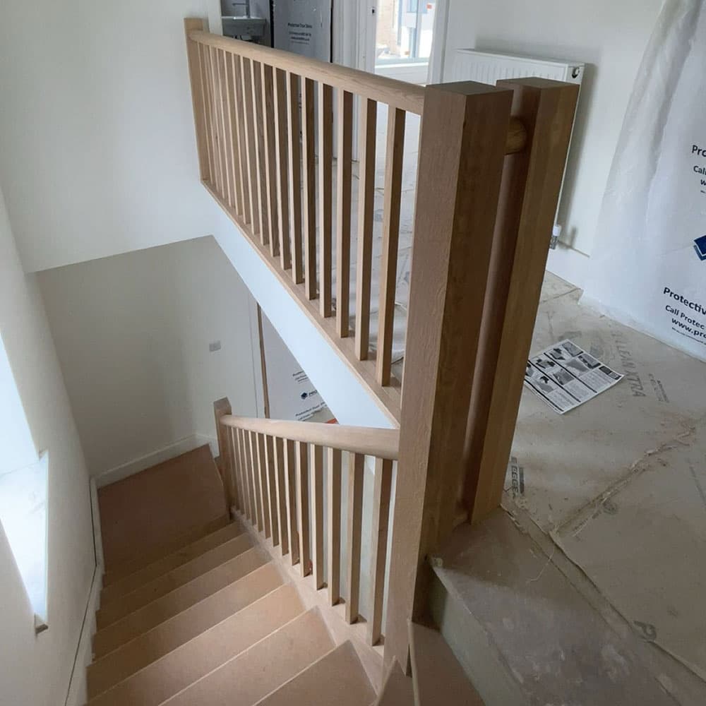 Wooden staircase with hand-turned wooden balustrades