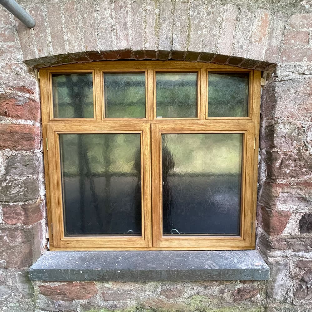 Sliding sash window seen from inside a Devon home